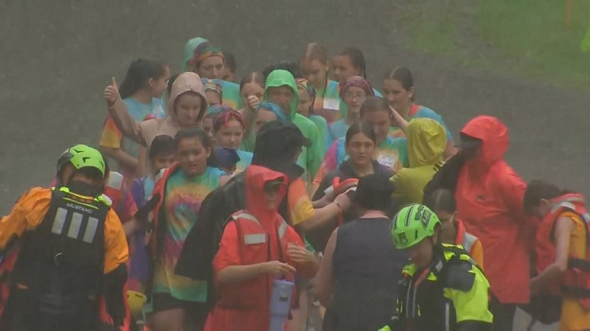 Girl Scouts being rescued from flood waters