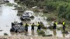 At least 4 dead and 2 missing in San Antonio flooding; smashed cars pulled from creek