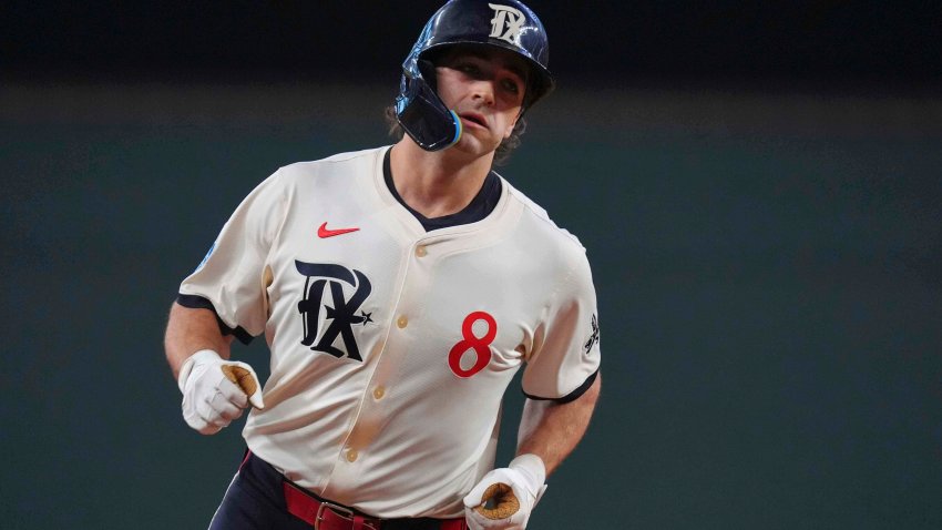 Texas Rangers’ Josh Smith runs the bases after hitting a home run during the third inning of a baseball game against the Chicago White Sox, Friday, June 13, 2025, in Arlington, Texas. (AP Photo/LM Otero)