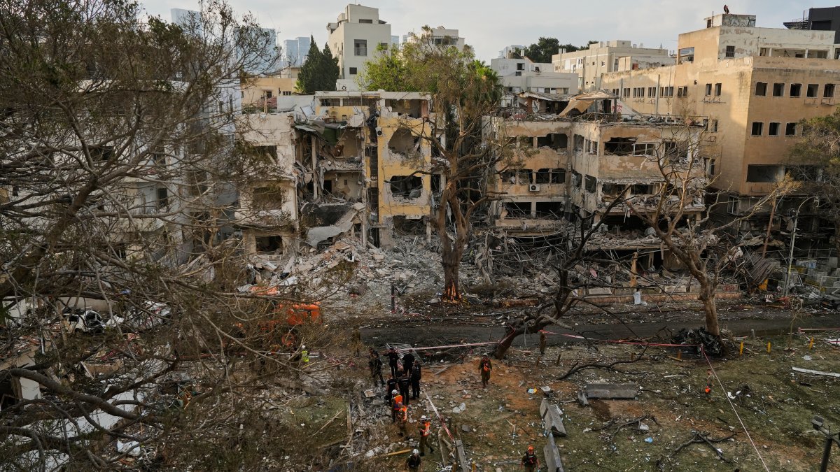 Iran announced it had launched some 100 missiles and vowed further retaliation for Israel's sweeping attacks on its military and nuclear infrastructure.