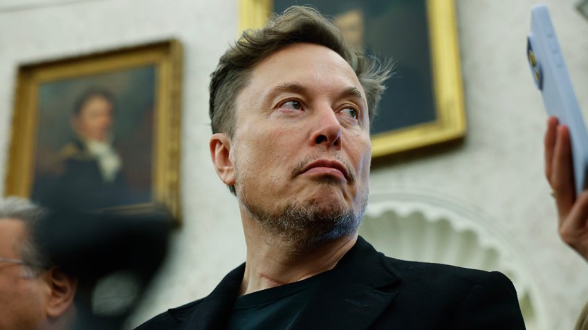 File - Elon Musk listens as reporters ask U.S. President Donald Trump and South Africa President Cyril Ramaphosa questions during a press availability in the Oval Office at the White House on May 21, 2025.