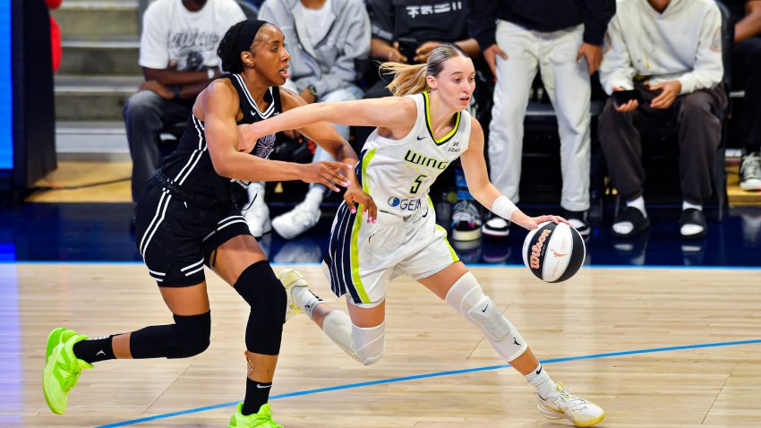 ARLINGTON, TX – JUNE 17: Dallas Wings guard Paige Bueckers (5) drives towards the basket against Golden State Valkyries forward Kayla Thornton (left) during the fourth quarter of a WNBA game between the Golden State Valkyries and Dallas Wings on Tuesday, June 17, 2025 at College Park Center in Arlington, TX.