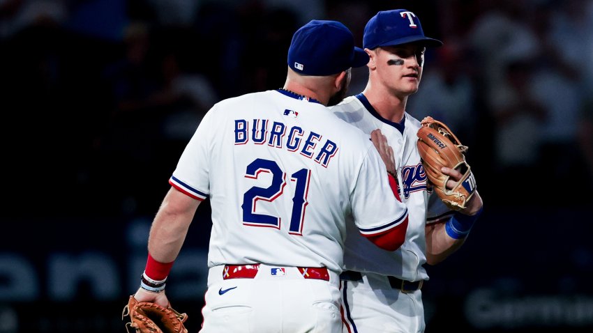 May 27, 2025; Arlington, Texas, USA; Texas Rangers first baseman Jake Burger (21) celebrates with Texas Rangers third baseman Josh Jung (6) after the game against the Toronto Blue Jays at Globe Life Field. Mandatory Credit: Kevin Jairaj-Imagn Images