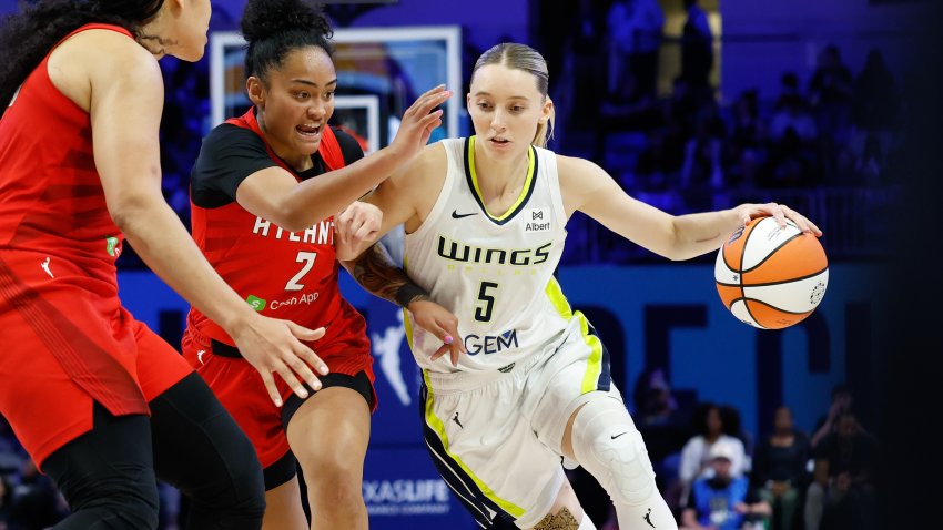 Jun 24, 2025; Arlington, Texas, USA; Dallas Wings guard Paige Bueckers (5) drives to the basket against Atlanta Dream guard Te-Hina Paopao (2) during the second half at College Park Center.