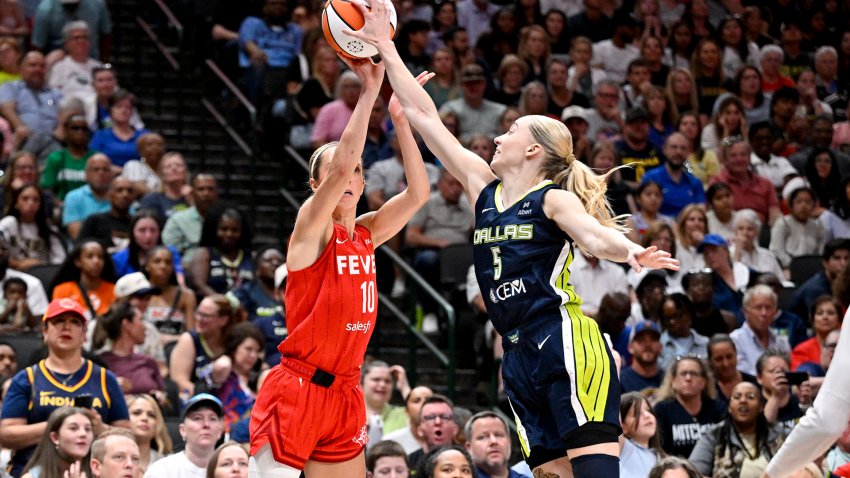 Jun 27, 2025; Dallas, Texas, USA; Dallas Wings guard Paige Bueckers (5) blocks a shot by Indiana Fever guard Lexie Hull (10) during the second half at the American Airlines Center.