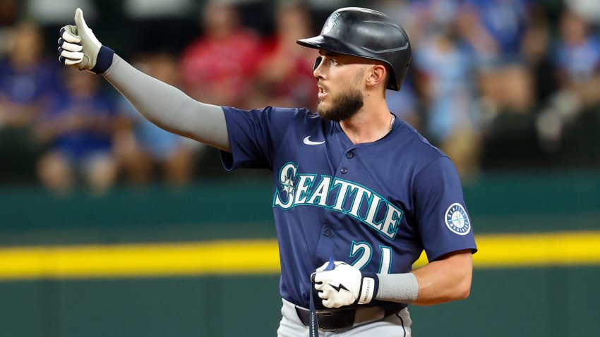 Jun 27, 2025; Arlington, Texas, USA;  Seattle Mariners third baseman Miles Mastrobuoni (21) reacts after hitting an rbi single during the twelfth inning against the Texas Rangers at Globe Life Field.