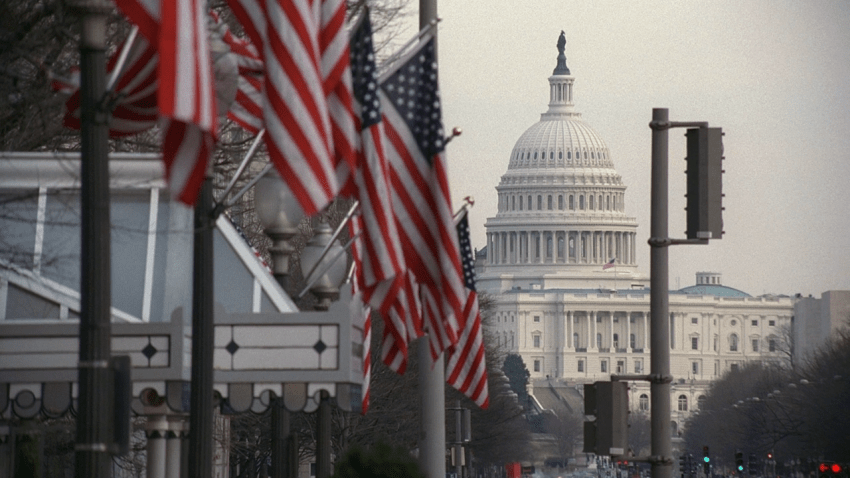 White House in background with row of American flags