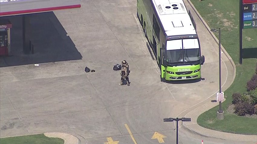 A suspicious bag that was phoned in to police as a bomb threat Monday morning has led to an evacuation of a charter bus and a road closure in Plano, police say.