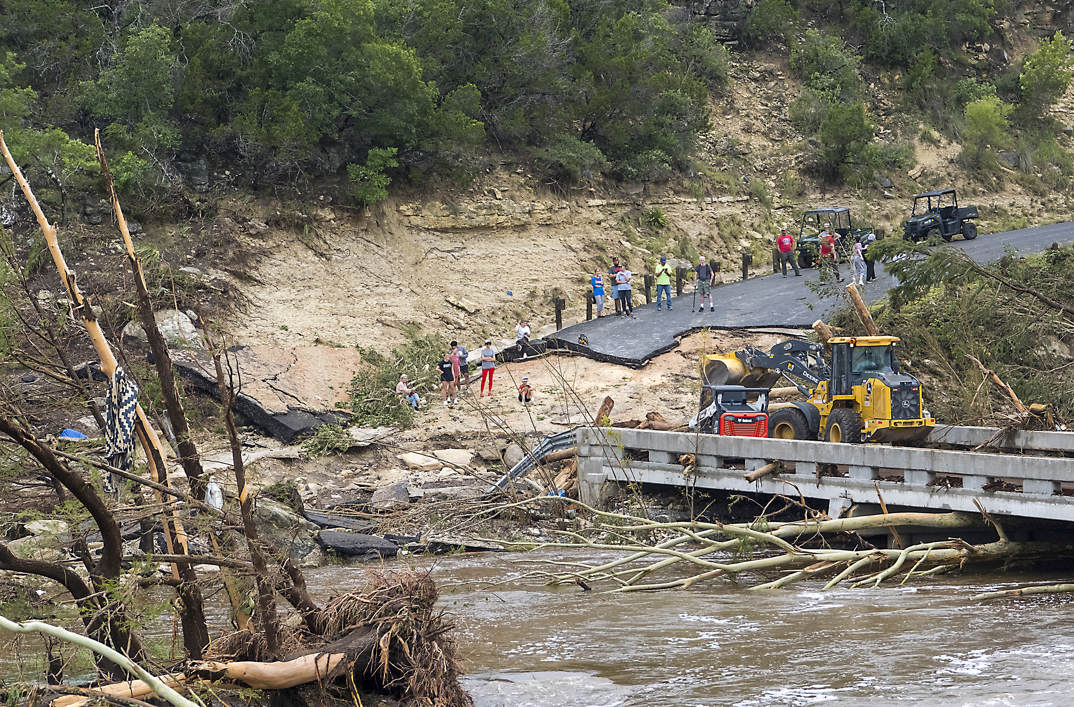 Search for missing campers plows forward after deadly flash floods