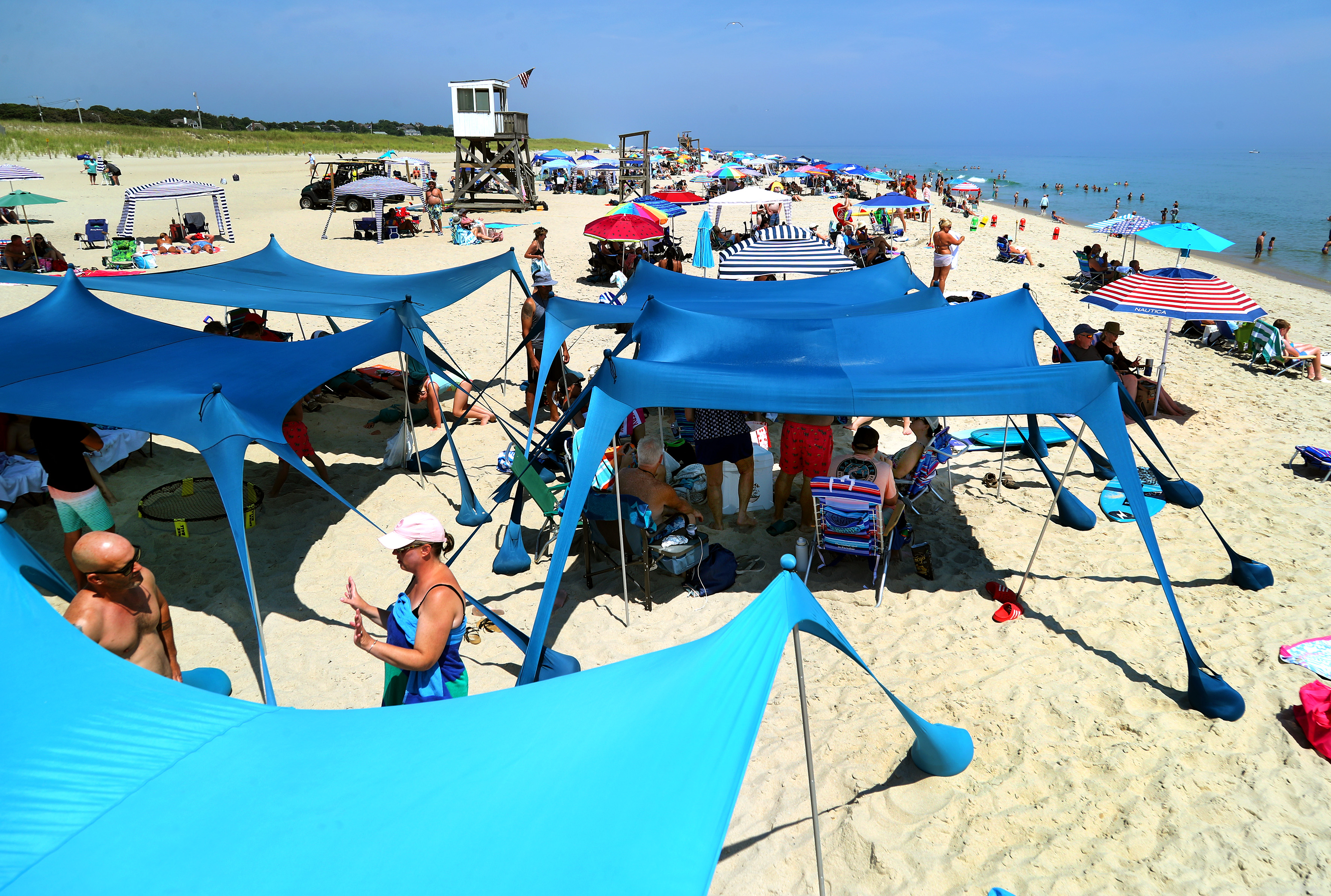 Do you like to ‘Beach Sprawl'? Why oversized tents and cabanas are sparking a debate