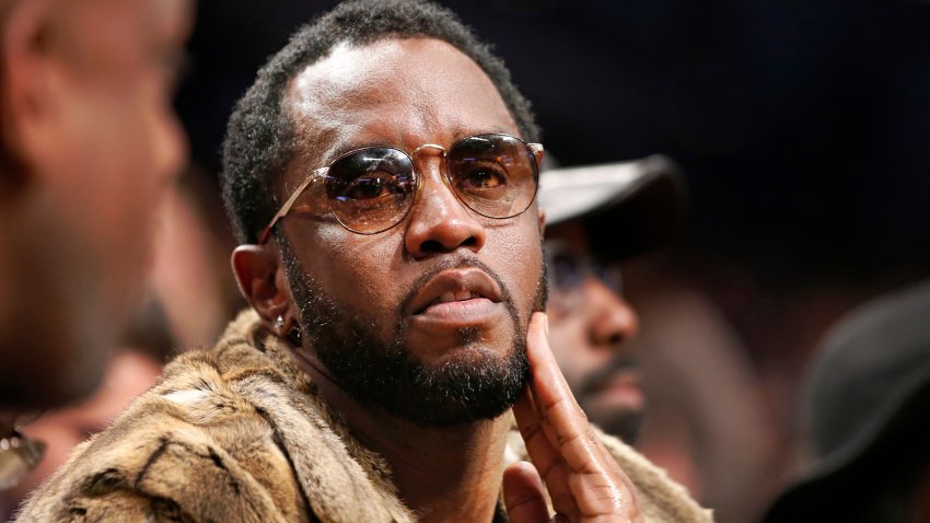 FILE – Sean “Diddy” Combs sits courtside in the second half of an NBA basketball game between the Brooklyn Nets and the New York Knicks, March 12, 2017, in New York.