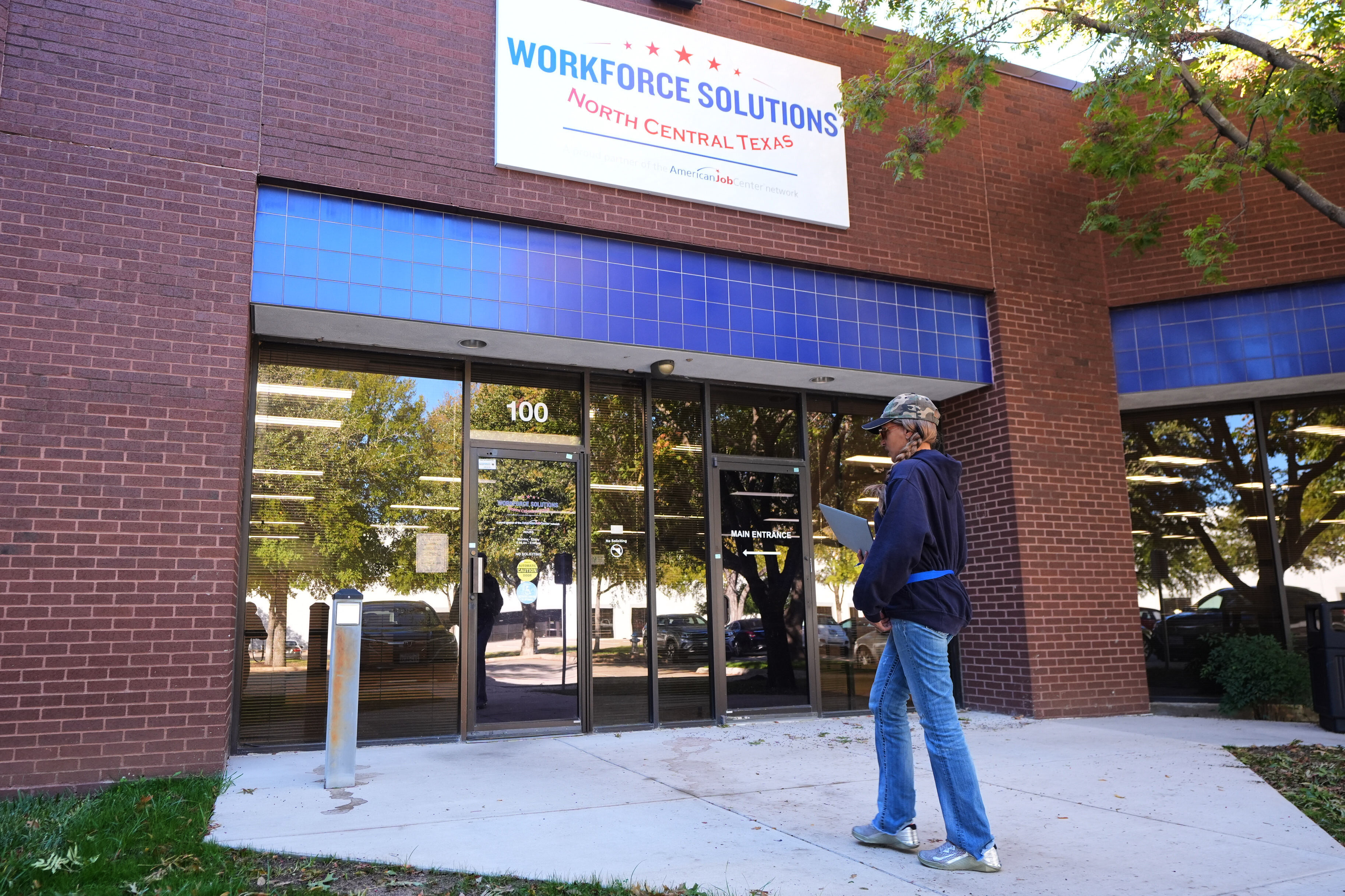 Cela Bratton Williams walks into the Workforce Solutions of North Central Texas office