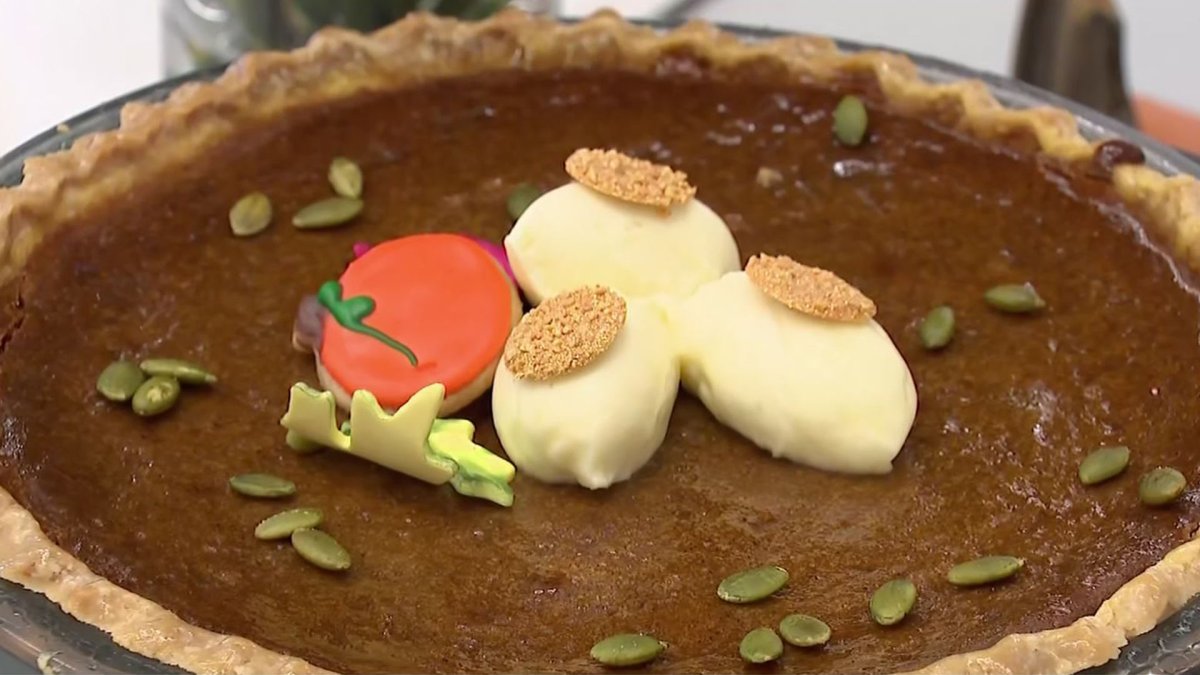 Join over 90,000 fans at the Cowboys vs Chiefs game enjoying a Thanksgiving feast with massive quantities of food.