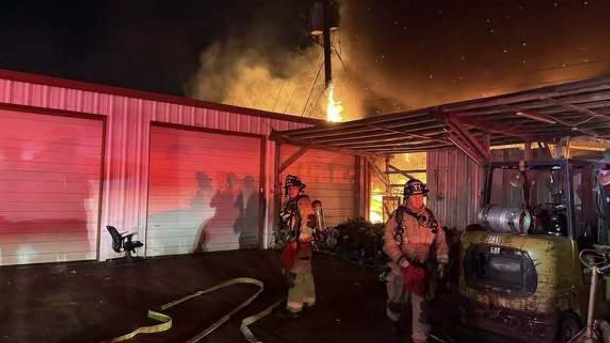 Fire damages Arlington shop, affects power and rail services.