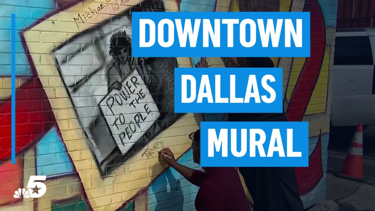 A vibrant mural with a sign saying