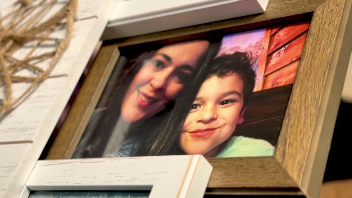A teacher mourns her son's death in a crash and demands safety changes at a busy intersection.