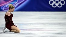 Amber Glenn reacts after competing in the figure skating women's single skating short program.