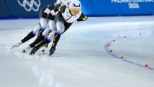 Miho Takagi, Ayano Sato, and Momoka Horikawa of Japan skate during a semifinal in the women's team pursuit.