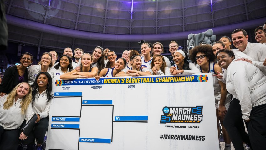 TCU poses for a photo with a March Madness bracket after the second round of the NCAA college basketball tournament Sunday, March 22, 2026, Fort Worth, Texas.