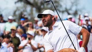 Scottie Scheffler reacts to his tee shot off the 16th hole during the third round of The Players Championship golf tournament at TPC Sawgrass, in Ponte Vedra Beach, Fla. Saturday March 14, 2026.