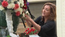 Tisa Zellers works on her creation for Fleurs de Villes, March 2026 at NorthPark Center.