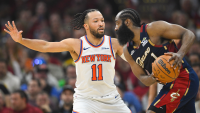 New York Knicks guard Jalen Brunson (11) defends Cleveland Cavaliers guard James Harden (1) in the third quarter during game three of the eastern conference finals for the 2026 NBA playoffs at Rocket Arena.