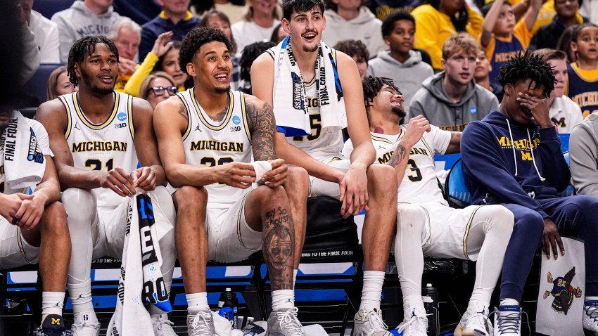 From left, Michigan forward Morez Johnson Jr., forward Yaxel Lendeborg, center Aday Mara, guard Elliot Cadeau and guard L.J. Cason watch the final seconds of the game against Howard from the bench at the NCAA tournament in the first round at KeyBank Center in Buffalo on Thursday, March 19, 2026.
