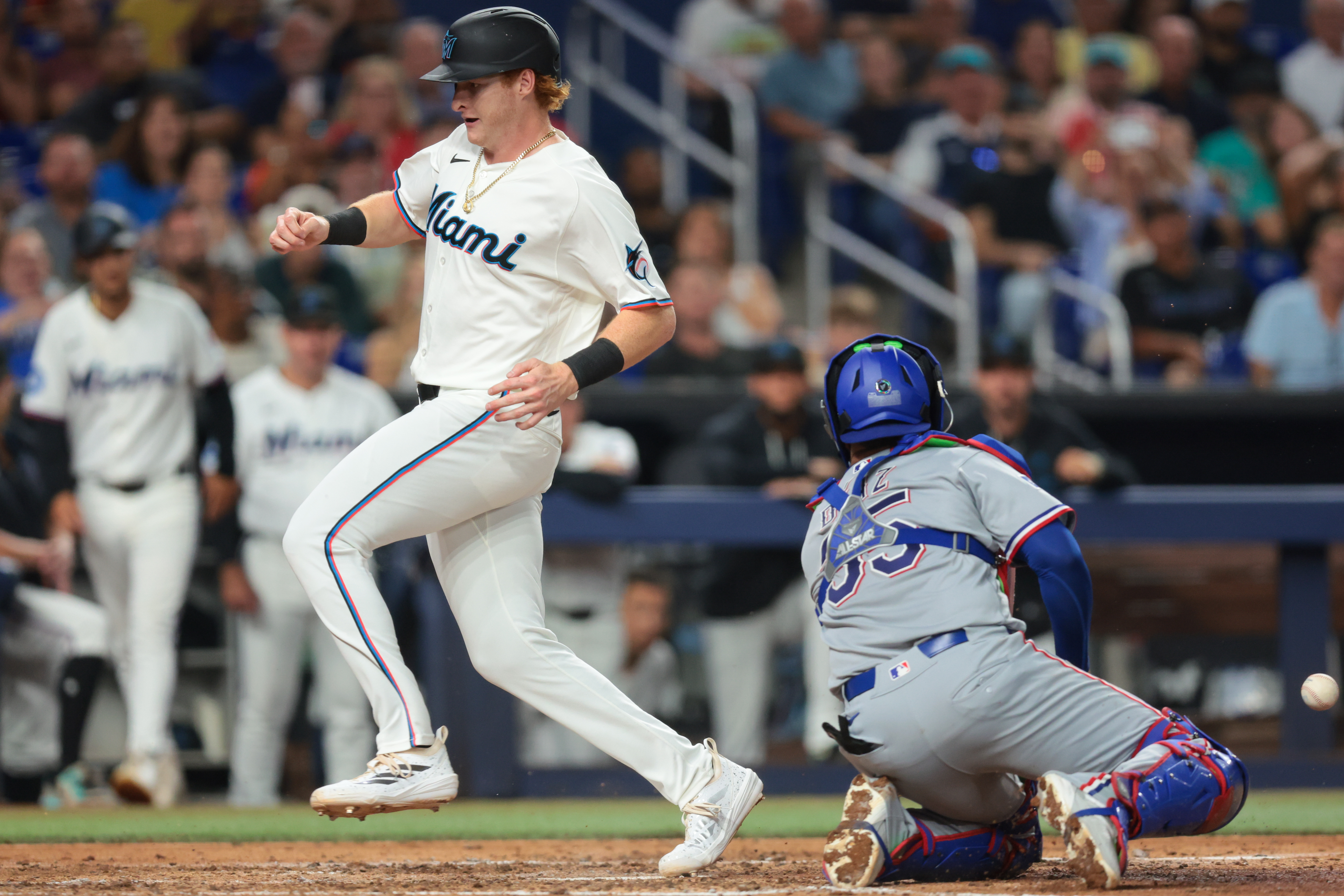 Rangers rally past Marlins behind Nimmo, Osuna in series opener