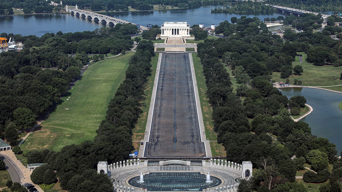 Drained Reflecting Pool shows Trump's ‘American flag blue' liner now closer to gray