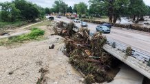 An aerial view shows debris along the Guadalupe River after a series of storms Friday, July 17, 2026, in Kerrville, Texas. (AP Photo/Gerald Herbert)