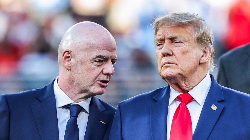 Gianni Infantino and Donald Trump on the World Cup final podium.