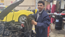Carlos Flores working on the car that will be gifted to Channing for his new beginning.