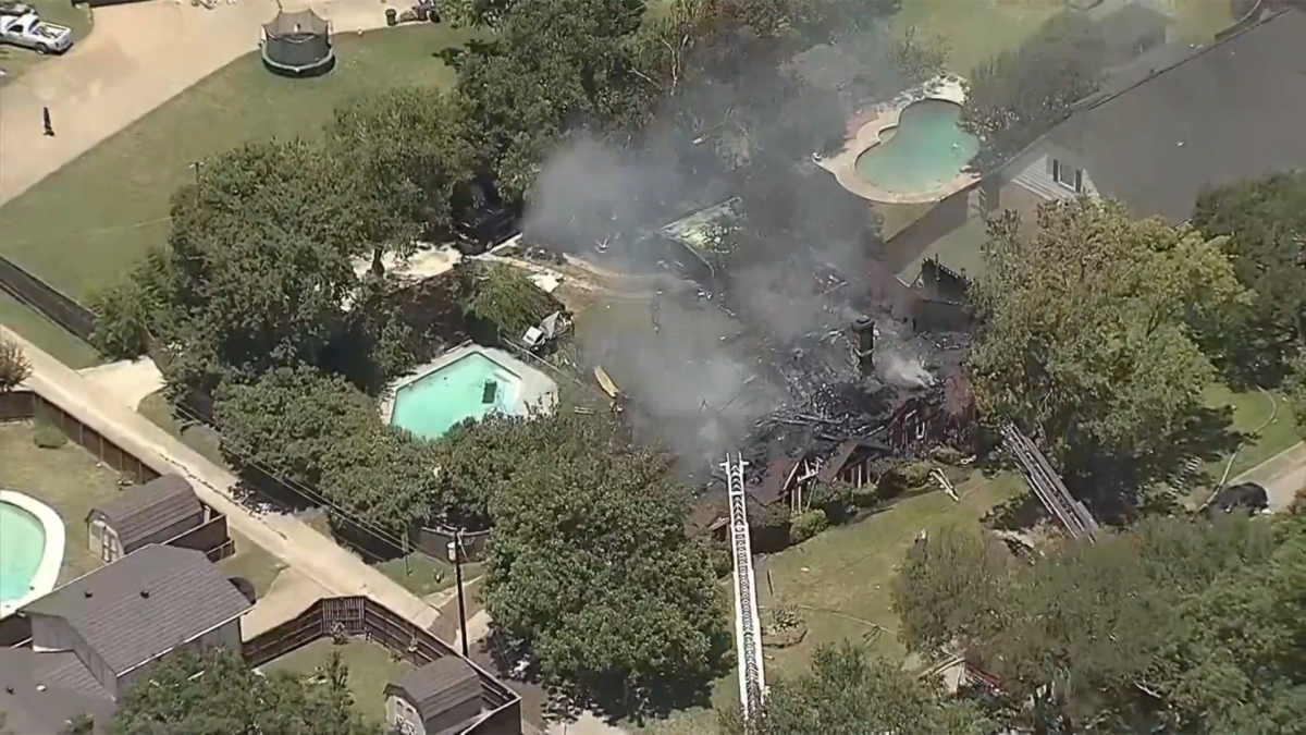 Evacuations ordered after a large residential fire and nearby road closures
