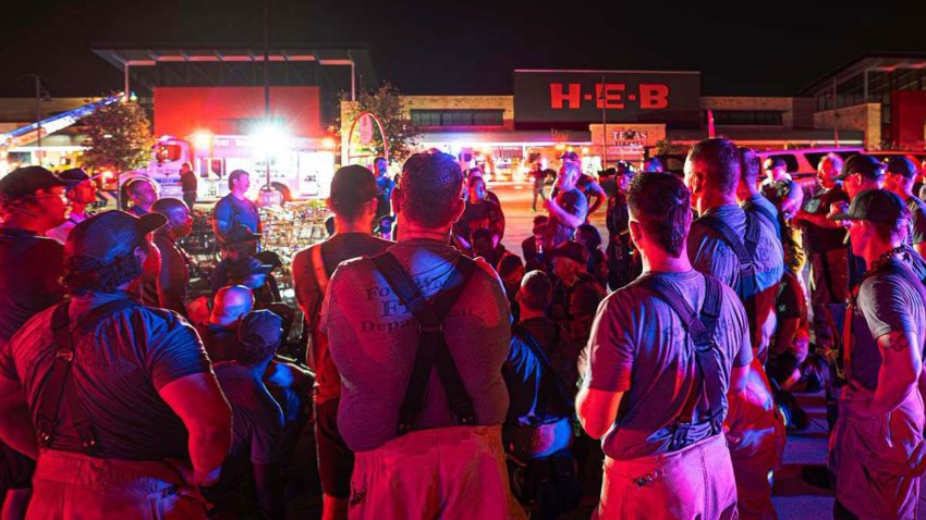 Fort Worth Firefighters outside an H-E-B grocery store in far North Fort Worth, where an electrical fire sparked a three-alarm response on Thursday, July 9, 2026.
