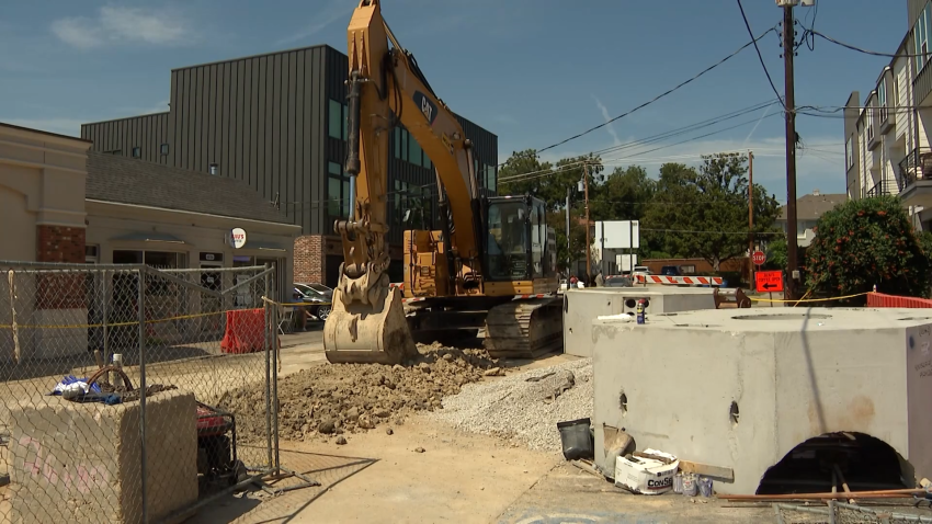 Image of an Oncor electrical construction project that has closed parts of a busy street and cut off parking in East Dallas.