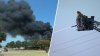 About 30 cars in flames as crews battle Grand Prairie parking lot fire