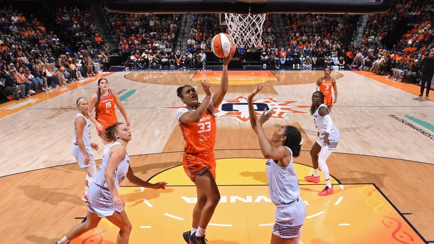 Nell Angloma #33 of the Connecticut Sun drives to the basket.
