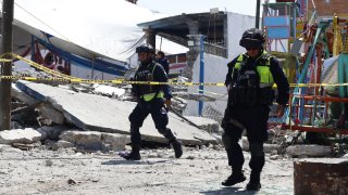 Mexican State Police officers inspect the site of a fireworks blast in Santa Maria Canchesda, Mexico state, Mexico on September 6, 2026.