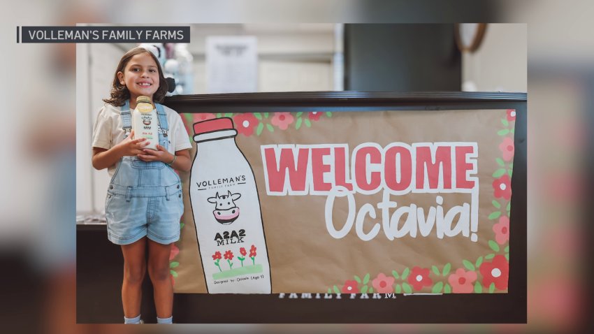 Octavia and her family present a check for $3,500 to The Children’s Health Foundation. The money came from the proceeds of the sale of a milk bottle designed by the 7-year-old.