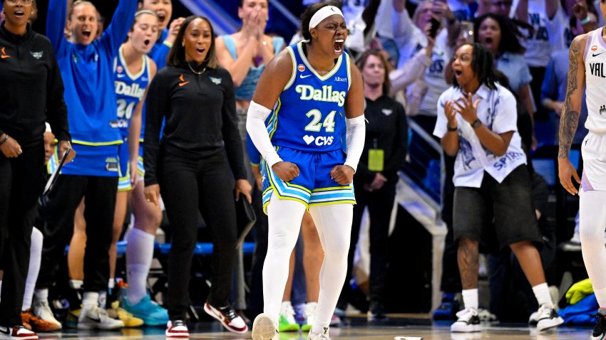 Sep 30, 2026; Arlington, Texas, USA; Dallas Wings guard Arike Ogunbowale (24) celebrates with her team after she makes a three point shot to tie the game against the Golden State Valkyries during the second half during game two of the first round for the 2026 WNBA Playoffs at College Park Center. Mandatory Credit: Jerome Miron-Imagn Images