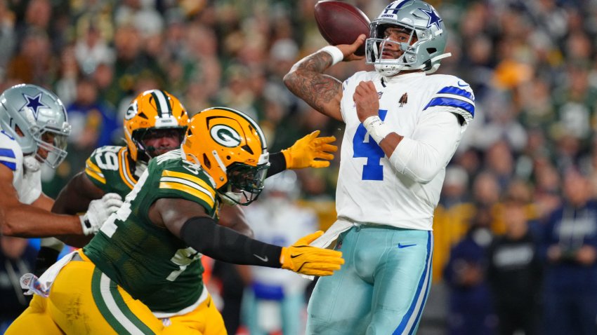 Oct 18, 2026; Green Bay, Wisconsin, USA; Dallas Cowboys quarterback Dak Prescott (4) is hit as he passes by Green Bay Packers linebacker Zaire Franklin (44) during the first half at Lambeau Field.