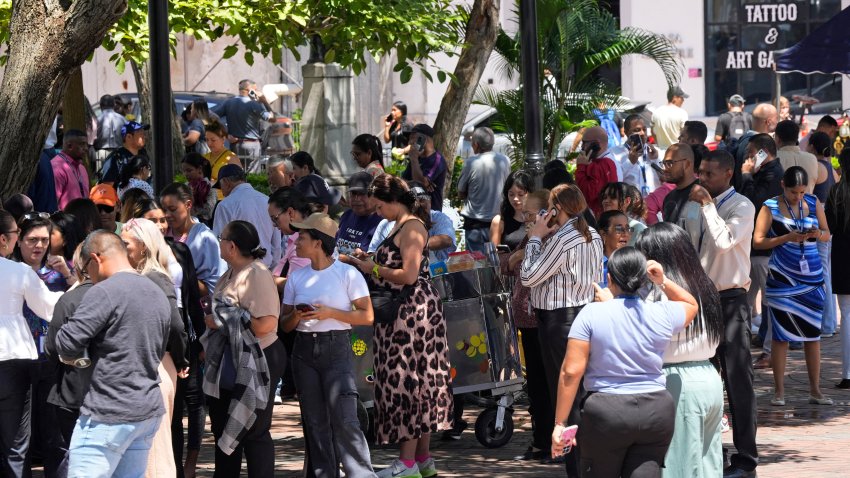 People evacuated from a building gather at a square after a severe earthquake hit the country, in Panama City on October 9, 2026.