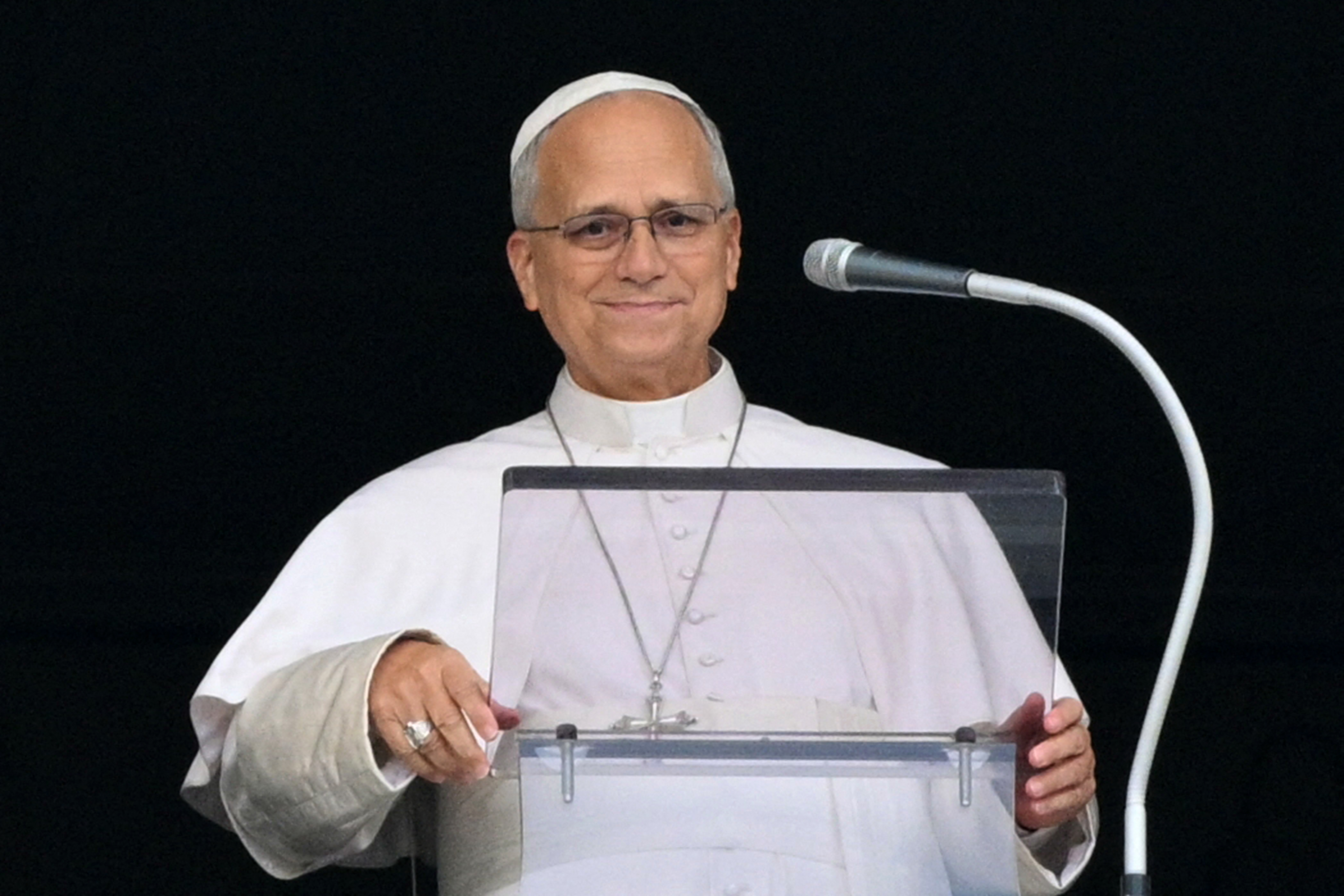 Pope Leo XIV addresses the crowd from the window of the apostolic palace overlooking St. Peter’s square during the Angelus prayer, a day after his return to The Vatican following a surgery to remove a cancerous tumour in his right lung, on October 18, 2026.