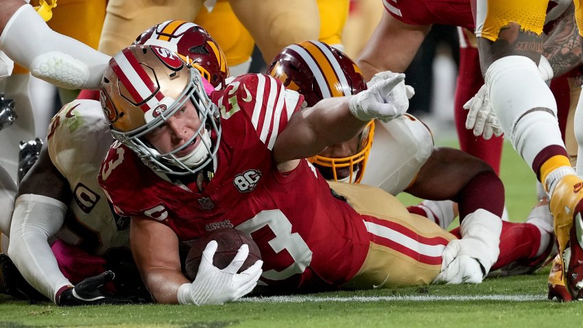 Christian McCaffrey #23 of the San Francisco 49ers celebrates after scoring a touchdown.