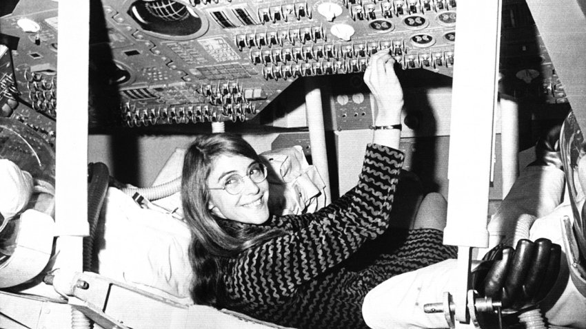 FILE - Margaret Hamilton, of Cambridge, Mass., mathematic and computer programmer at the MIT Instrumentation Laboratory, sits in mock up of Apollo command module on display at the Cambridge school, Nov. 25, 1969, where she headed group that programmed Intrepid's pinpoint landing in the Sea of Storms on the moon.