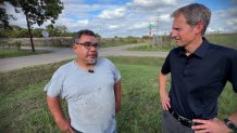 Daniel Davila, left, talks with NBC 5's Scott Friedman about his family's property in Dallas.