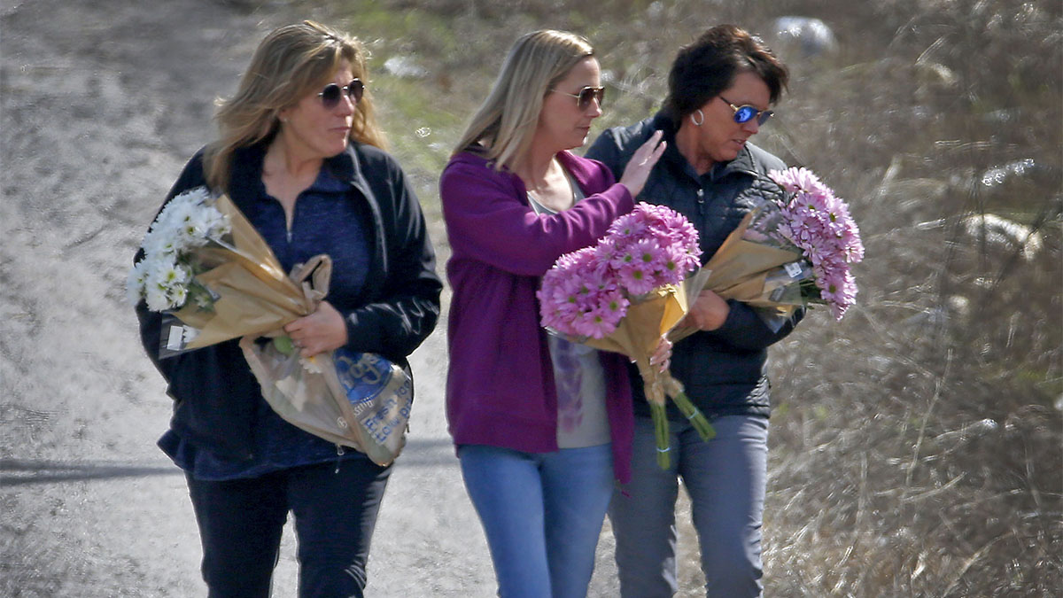 Christina Morris' Mother Places Flowers Where Remains Found