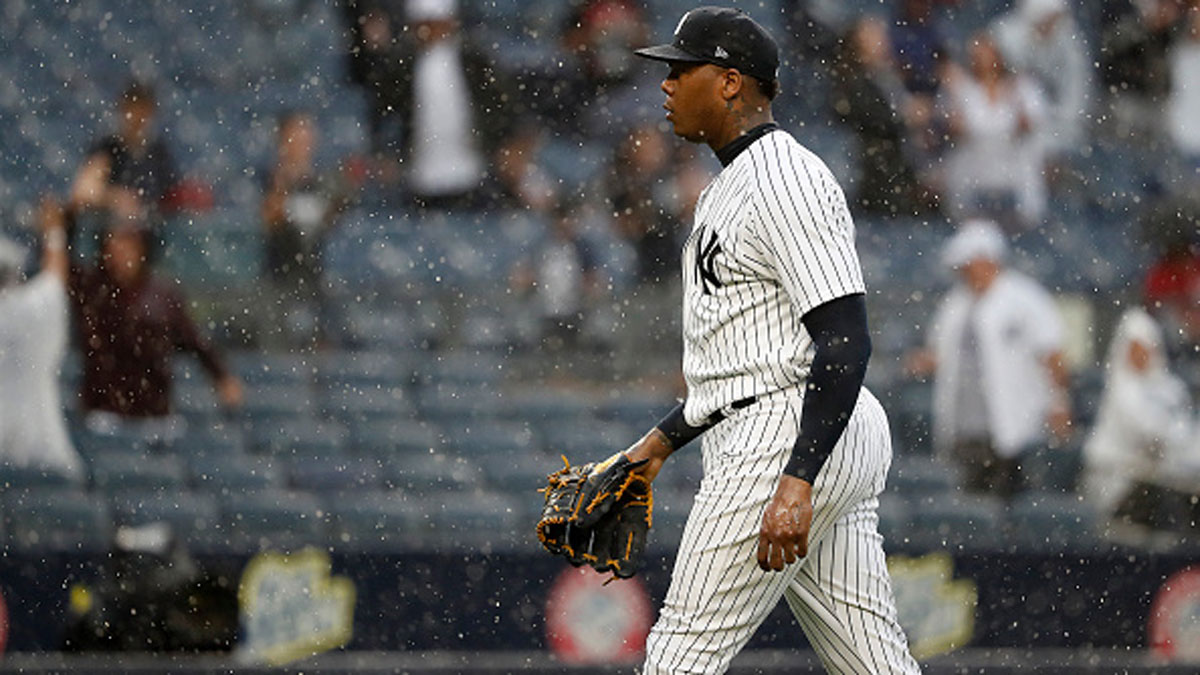 Chapman, Yankees Weather Heavy Rain, Hold Off Rangers