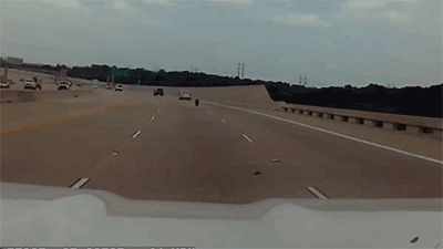 Runaway Tire Bounces Towards Driver